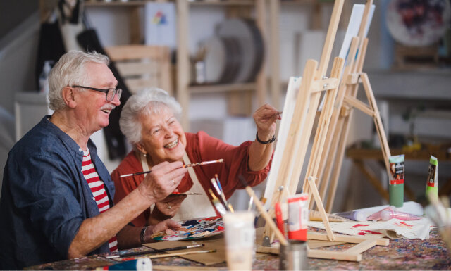 Elderly couple riding bicycles